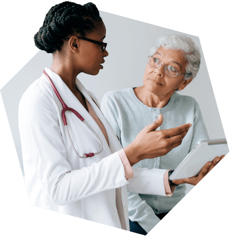 Older patient listening to her physician