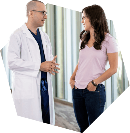 Doctor and his patient standing and speaking to each other