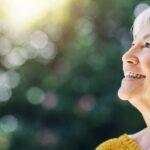 Woman smiling up while outside