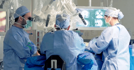 Surgeons performing brain surgery