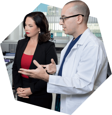 Catherine Ivy and Dr. Sanai reviewing research