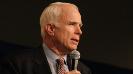 Senator John McCain speaking into mic