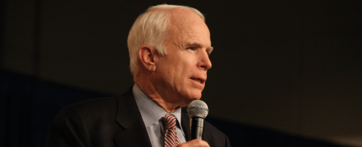 Senator John McCain speaking into mic
