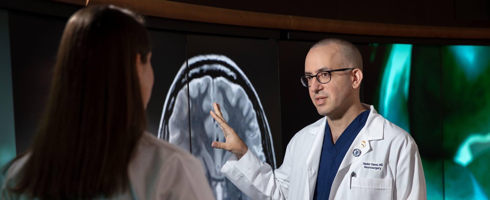 Dr. Sanai showing MRI scan