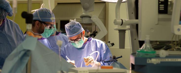 Dr. Nader Sanai performing surgery in operating room