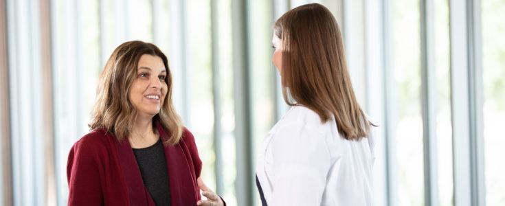 Nurse talking to brain tumor patient